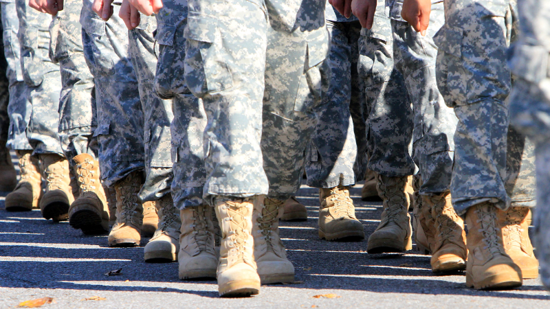 Military servicemembers walking.
